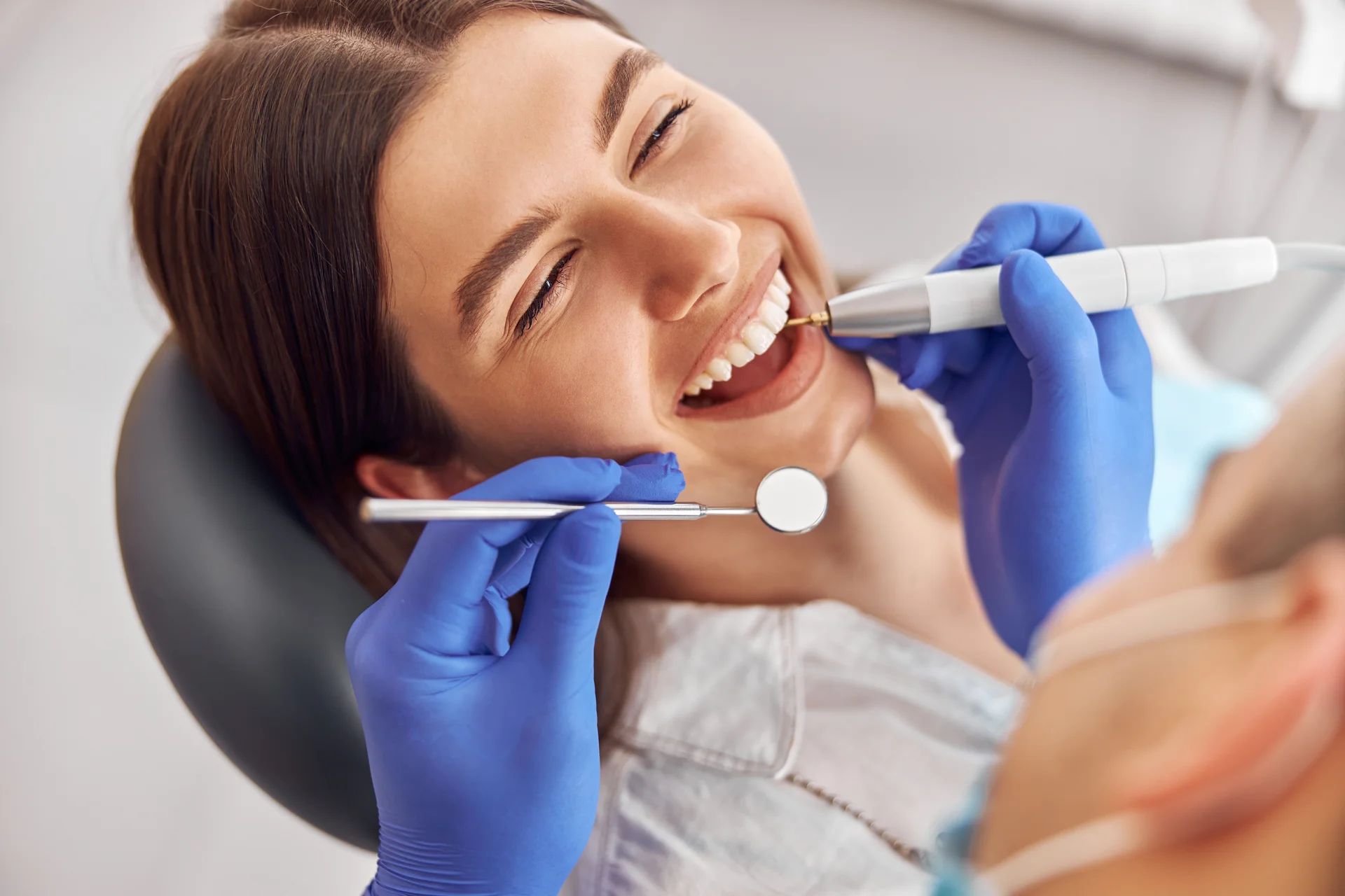 Dental team performing a routine exam with digital diagnostics