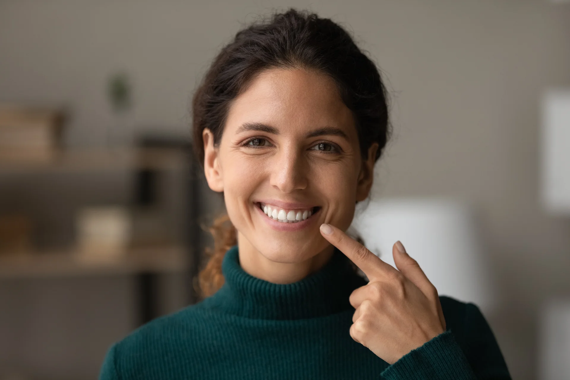 Patient smiling confidently after a full smile makeover plan